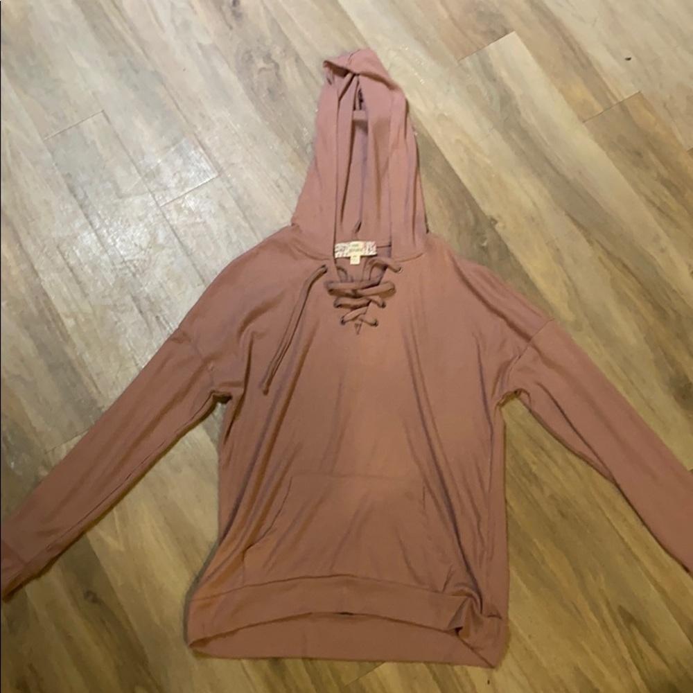 Pink lace-up long sleeve hoodie.